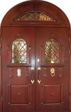 Стальная арочная дверь со стеклом и ковкой ДА-30 в дом из кирпича в Сургуте